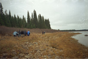 Innu in front of the Fall 1969 camp at Ushkan-shipiss where the last kushapatshikan was held. Photo courtesy Peter Armitage.