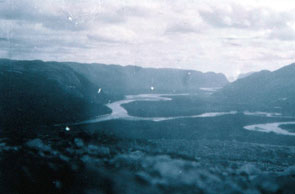 The junction of Kameshtashtan-shipu, Ashuapun-shipu and Emish-shipu. The river Ashuapun-shipu changes its name at the junction and becomes Emish-shipu. Uapanatsheu-natuashu in the distance. Courtesy Stephen Loring and the National Anthropological Archives, Smithsonian Institution.