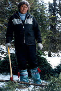 Nush Penashue gathering boughs for the tent floor at Kamashkushkatinau-nipi. Photo courtesy Camille Fouillard.